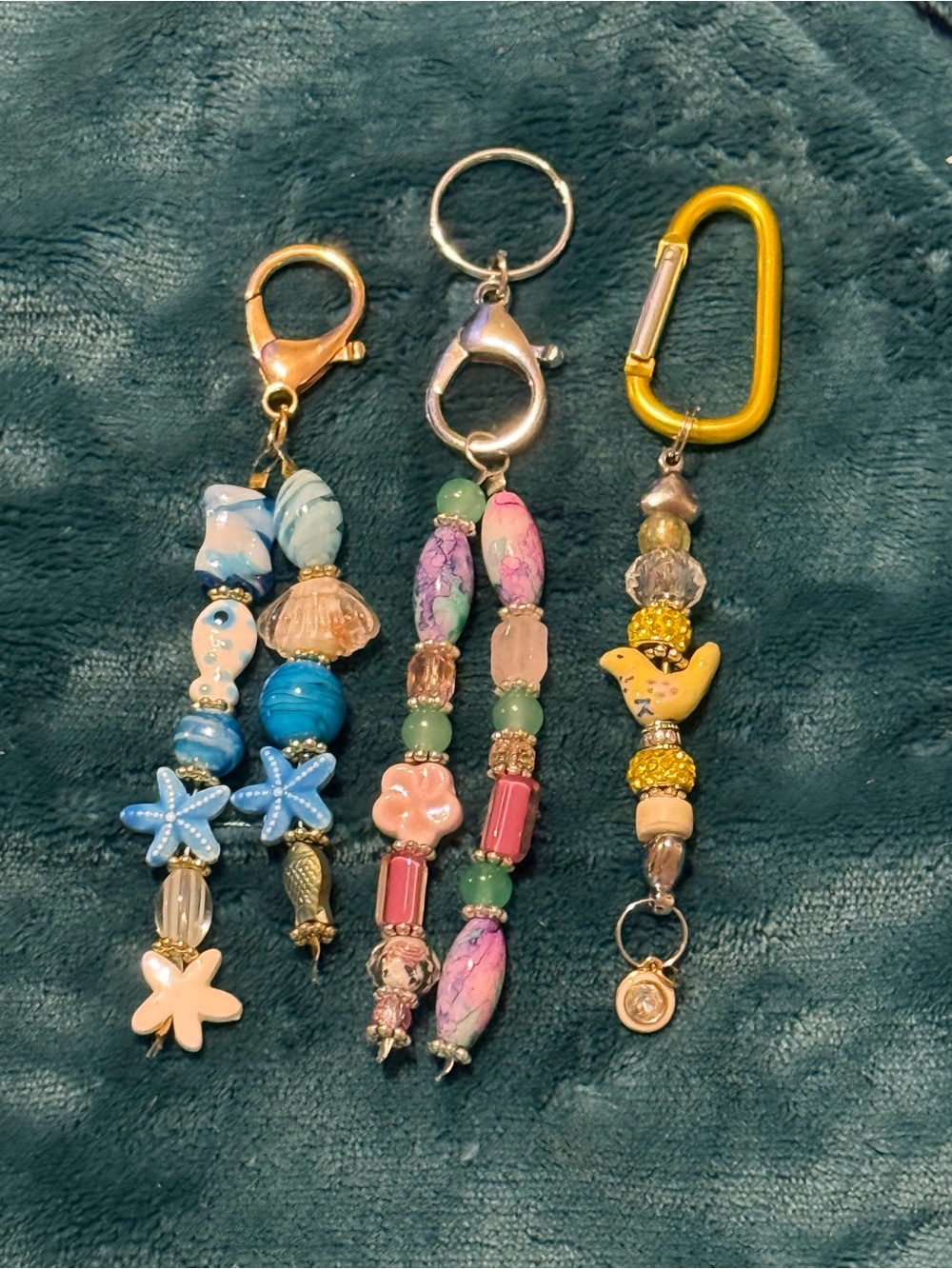 Four (4) multicolor beaded keychains